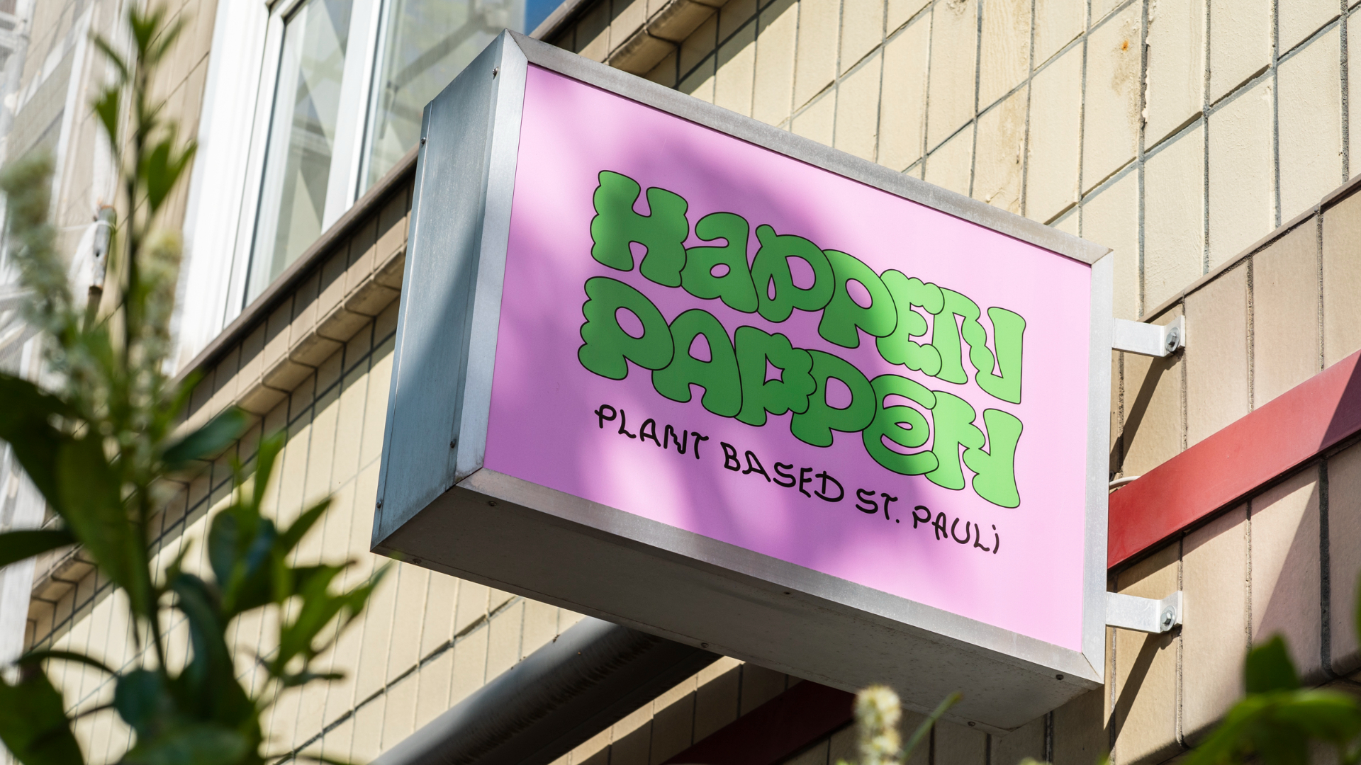 Schild des veganen Restaurants Happenpappen