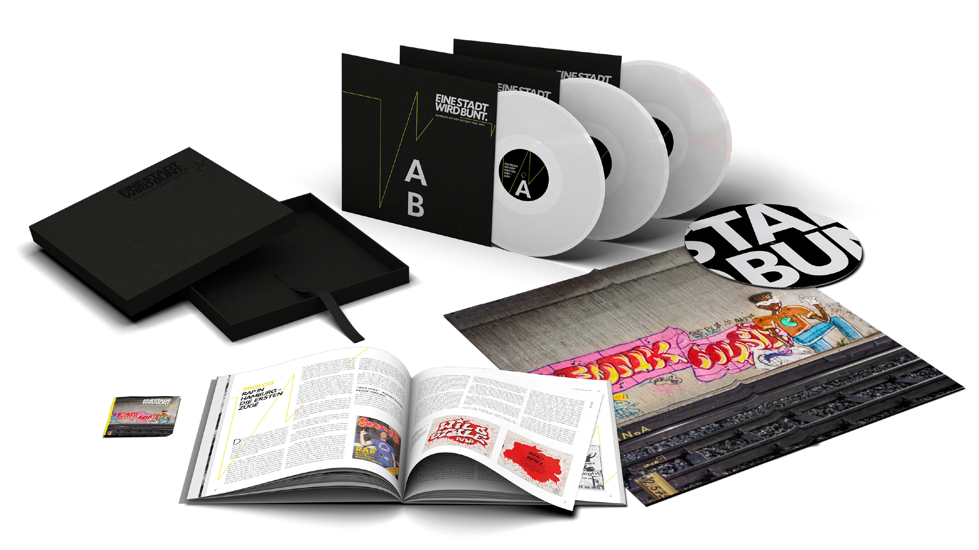 Bestandteile der "Collectors Box-Edition" von EINE STADT WIRD BUNT.